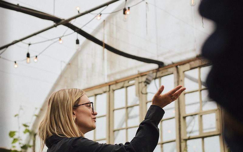 Employee explaining details about the farm at Espace Old Mill.